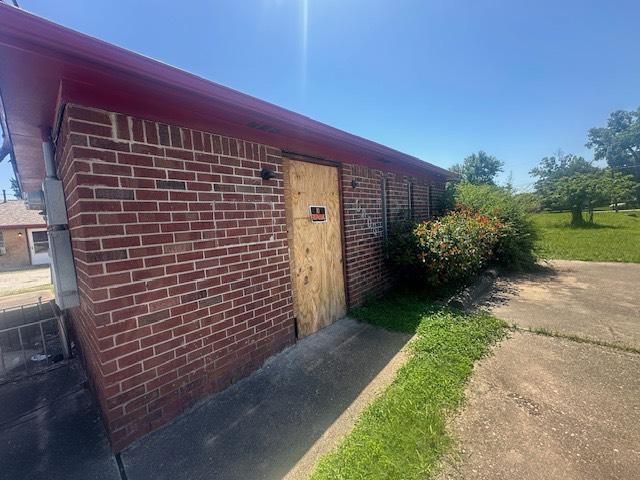 8008 De Priest St, Houston, TX 77088 - property entrance with brick siding