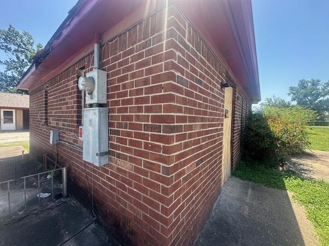 8008 De Priest St, Houston, TX 77088 - view of home's exterior featuring brick siding