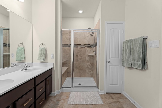 25419 Whitehaven Gate St, Katy, TX 77493 - full bath with baseboards, double vanity, and a shower stall