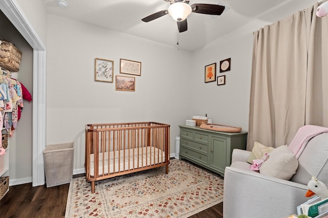 25419 Whitehaven Gate St, Katy, TX 77493 - bedroom featuring wood finished floors, a crib, ceiling fan, and baseboards