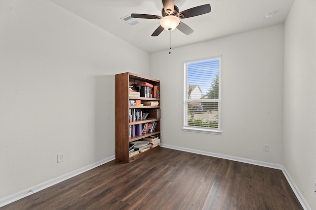25419 Whitehaven Gate St, Katy, TX 77493 - empty room featuring dark wood-style floors, baseboards, a ceiling fan, and a smoke detector