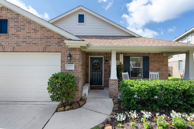 6103 Moran Crest Dr, Spring, TX 77388 - entrance to property with brick siding, a shingled roof, an attached garage, and a porch