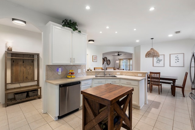 6103 Moran Crest Dr, Spring, TX 77388 - kitchen featuring dishwasher, a sink, arched walkways, a peninsula, and recessed lighting