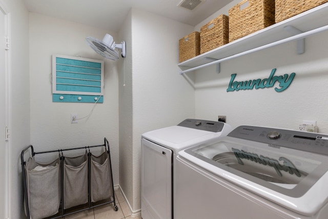 6103 Moran Crest Dr, Spring, TX 77388 - laundry room featuring independent washer and dryer, light tile patterned floors, and baseboards