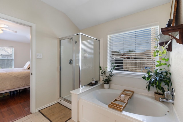 6103 Moran Crest Dr, Spring, TX 77388 - ensuite bathroom with a stall shower, a garden tub, vaulted ceiling, a ceiling fan, and tile patterned floors