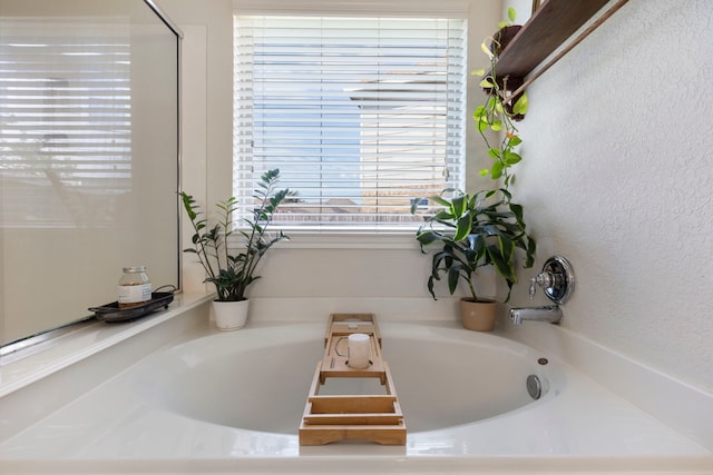 6103 Moran Crest Dr, Spring, TX 77388 - full bath with a bath and a textured wall