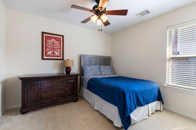 6103 Moran Crest Dr, Spring, TX 77388 - bedroom with light colored carpet, a ceiling fan, and baseboards