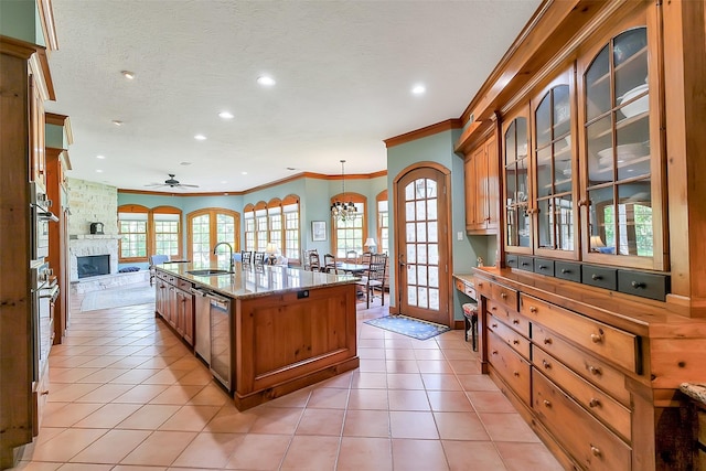 5318 Westerham St, Fulshear, TX 77441 - kitchen featuring ornamental molding, a sink, recessed lighting, ceiling fan, and open floor plan