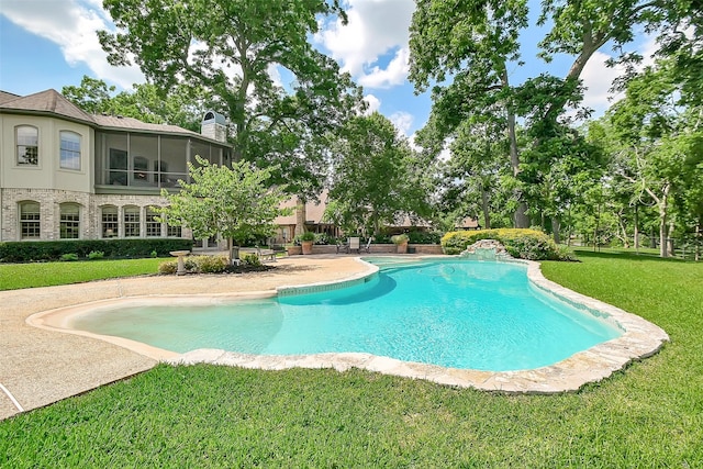 5318 Westerham St, Fulshear, TX 77441 - outdoor pool featuring a lawn and a sunroom