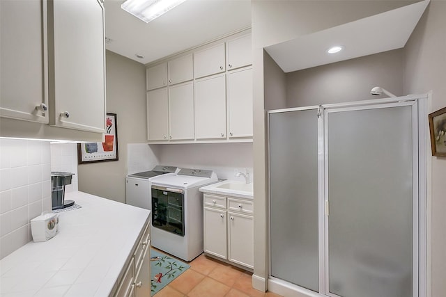 5318 Westerham St, Fulshear, TX 77441 - laundry room featuring cabinet space, independent washer and dryer, and light tile patterned floors