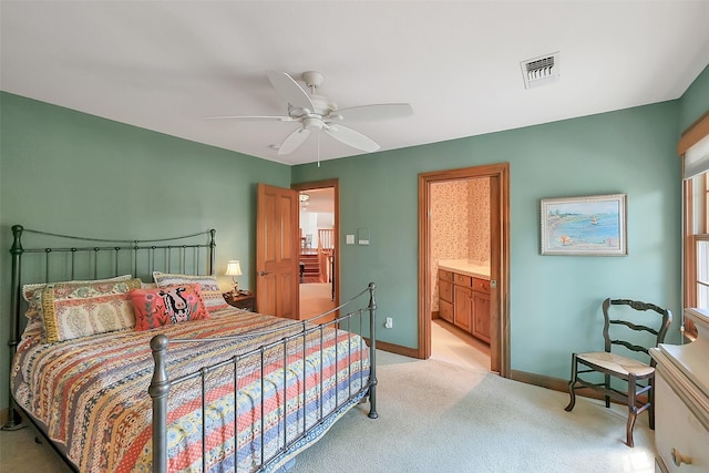 5318 Westerham St, Fulshear, TX 77441 - bedroom with light carpet, baseboards, ensuite bath, and a ceiling fan