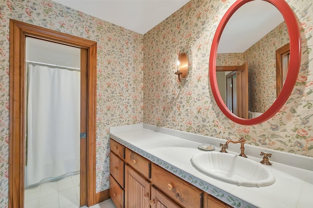 5318 Westerham St, Fulshear, TX 77441 - full bathroom featuring vanity, wallpapered walls, a shower with curtain, and tile patterned floors