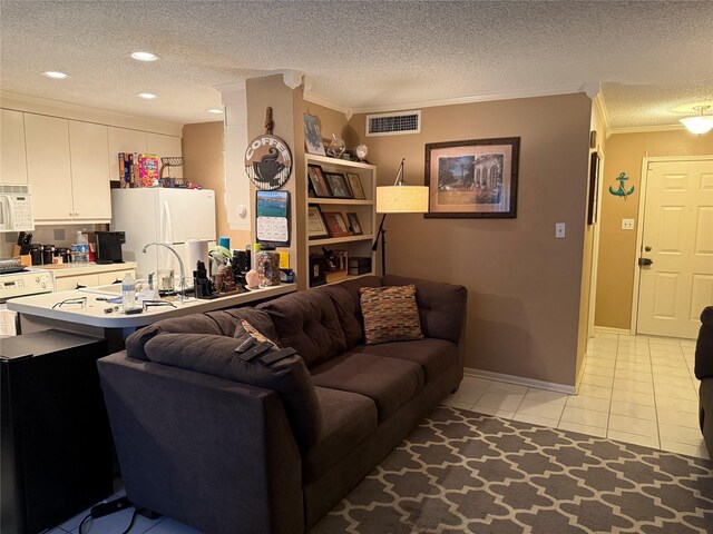 2120 El Paseo St Unit 209, Houston, TX 77054 - living area featuring a textured ceiling, crown molding, light tile patterned floors, recessed lighting, and baseboards