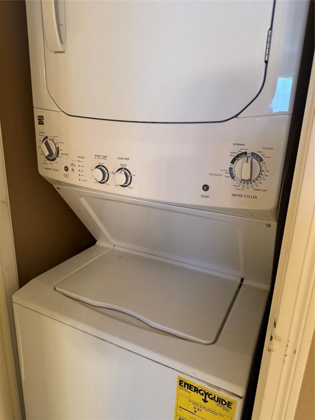 2120 El Paseo St Unit 209, Houston, TX 77054 - washroom with stacked washer / dryer