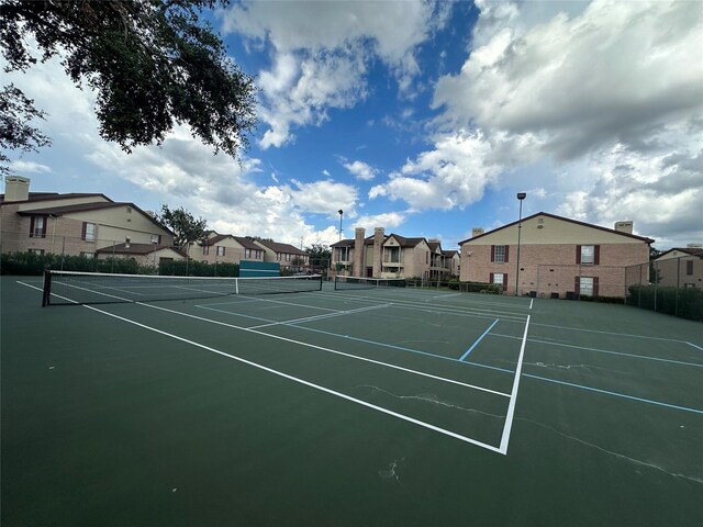 2120 El Paseo St Unit 209, Houston, TX 77054 - view of tennis court featuring a residential view