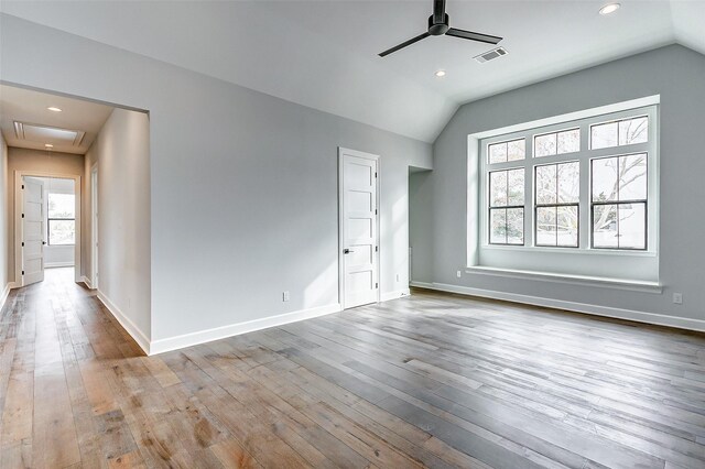 6522 Westview Dr, Houston, TX 77055 - unfurnished bedroom featuring vaulted ceiling, hardwood / wood-style floors, recessed lighting, baseboards, and attic access