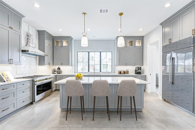 6522 Westview Dr, Houston, TX 77055 - kitchen featuring high end appliances, gray cabinetry, a kitchen island, backsplash, and recessed lighting
