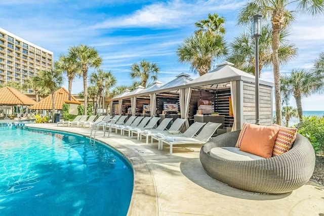 5220 Seawall Blvd Unit 1035, Galveston, TX 77551 - community pool featuring a gazebo and a patio