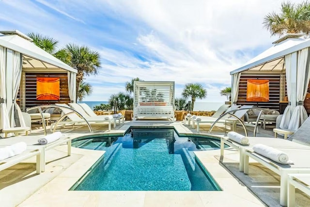 5220 Seawall Blvd Unit 1035, Galveston, TX 77551 - swimming pool featuring a patio