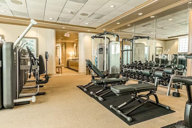 5220 Seawall Blvd Unit 1035, Galveston, TX 77551 - exercise room with ornamental molding, a paneled ceiling, recessed lighting, carpet, and baseboards