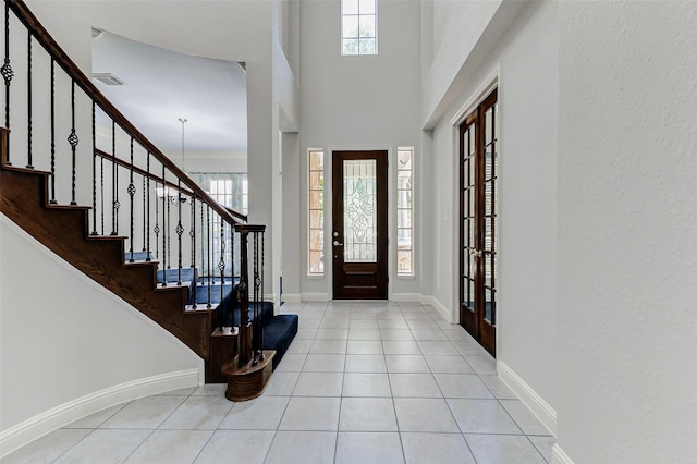 22110 Stone Cross Ct, Katy, TX 77450 - foyer featuring tile patterned flooring, baseboards, stairway, and french doors