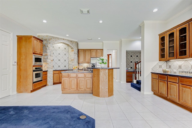 22110 Stone Cross Ct, Katy, TX 77450 - kitchen with stainless steel appliances, light tile patterned flooring, recessed lighting, glass insert cabinets, and backsplash