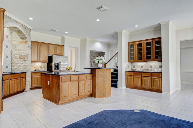 22110 Stone Cross Ct, Katy, TX 77450 - kitchen with stainless steel fridge with ice dispenser, light tile patterned flooring, tasteful backsplash, a center island, and recessed lighting