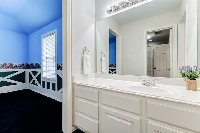 22110 Stone Cross Ct, Katy, TX 77450 - bathroom featuring vanity, wood finished floors, and lofted ceiling