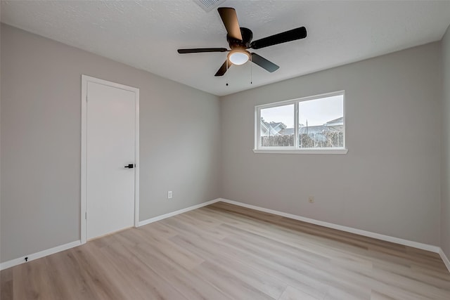 23227 Pine Post Ln, Spring, TX 77373 - empty room with light wood-style flooring, baseboards, and a ceiling fan