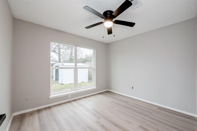 23227 Pine Post Ln, Spring, TX 77373 - empty room with light wood-type flooring, baseboards, and a ceiling fan