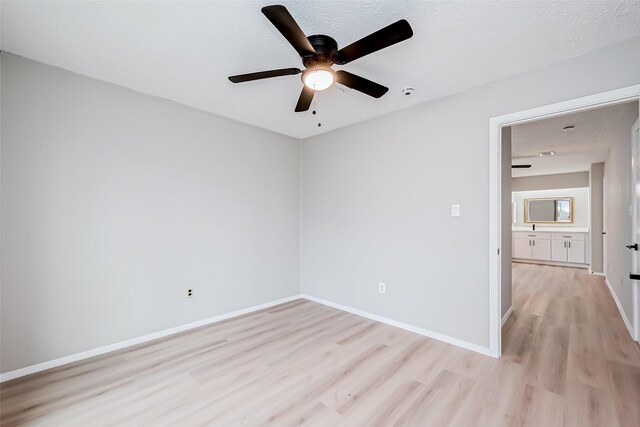 23227 Pine Post Ln, Spring, TX 77373 - empty room featuring light wood finished floors, ceiling fan, and baseboards