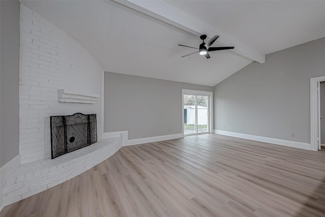 23227 Pine Post Ln, Spring, TX 77373 - unfurnished living room featuring a ceiling fan, a brick fireplace, wood finished floors, and baseboards