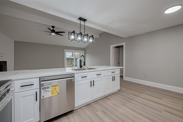 23227 Pine Post Ln, Spring, TX 77373 - kitchen featuring stainless steel appliances, a sink, light wood-style flooring, white cabinetry, and baseboards