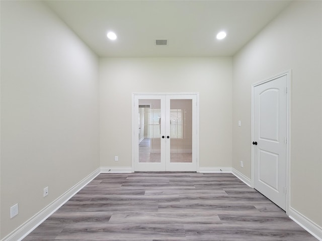 1314 Watercrest Park Ln, Rosenberg, TX 77471 - empty room with french doors, recessed lighting, wood finished floors, and baseboards