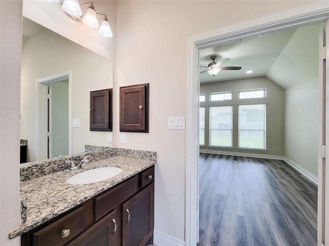 1314 Watercrest Park Ln, Rosenberg, TX 77471 - bathroom with vaulted ceiling, ceiling fan, wood finished floors, vanity, and baseboards