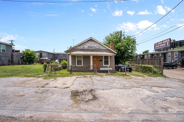 2007 Massie St, Houston, TX 77026 - view of front of property with a porch and a chimney