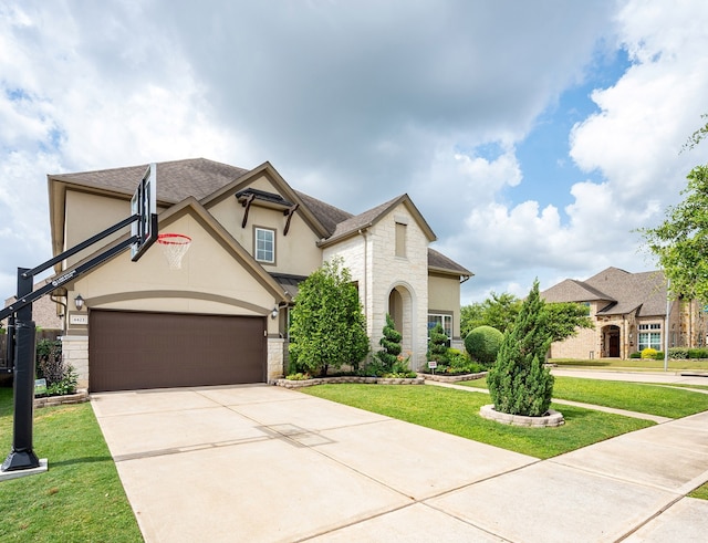4423 Sterling Heights Ln, Sugar Land, TX 77479 - french country style house with stucco siding, a front yard, driveway, an attached garage, and stone siding