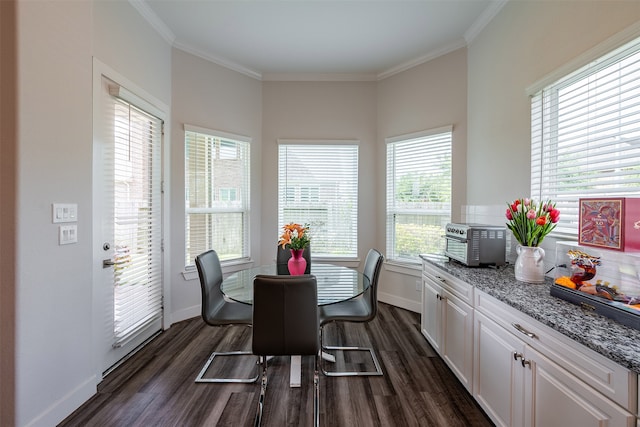 4423 Sterling Heights Ln, Sugar Land, TX 77479 - dining area with dark wood finished floors, baseboards, and ornamental molding