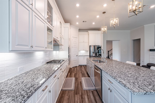 4423 Sterling Heights Ln, Sugar Land, TX 77479 - kitchen featuring a chandelier, a sink, dark wood finished floors, stainless steel appliances, and white cabinets