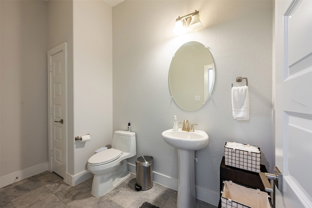 4423 Sterling Heights Ln, Sugar Land, TX 77479 - bathroom with toilet, a sink, and baseboards