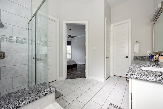 4423 Sterling Heights Ln, Sugar Land, TX 77479 - bathroom featuring a stall shower, vanity, connected bathroom, a ceiling fan, and tile patterned floors
