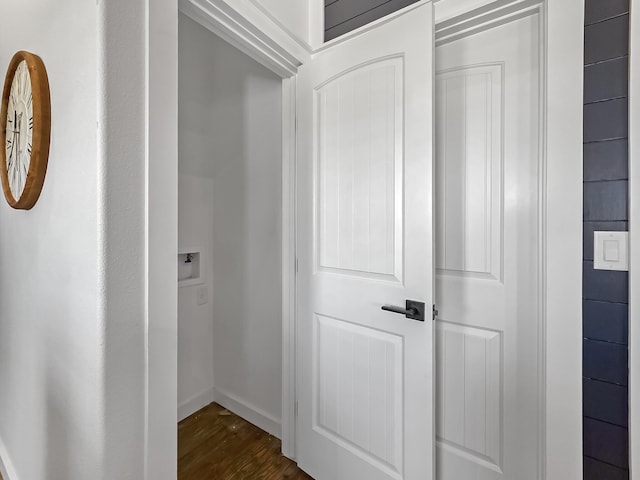 1025 Sunset Cir W, Crystal Beach, TX 77650 - corridor featuring dark wood-type flooring and baseboards