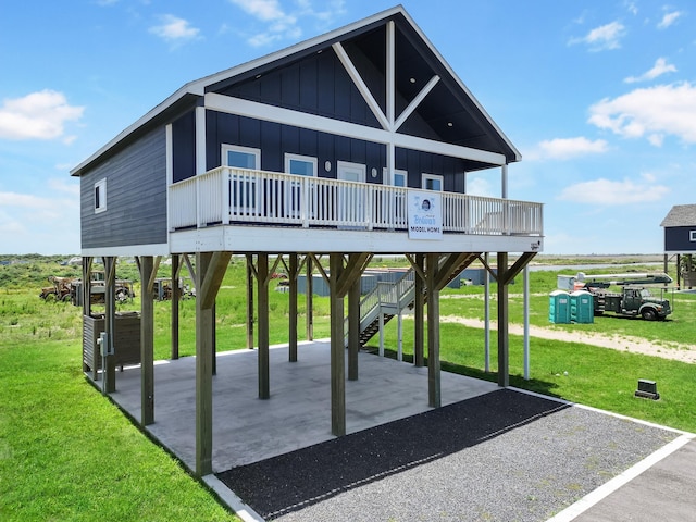 1025 Sunset Cir W, Crystal Beach, TX 77650 - surrounding community featuring a carport, a patio area, driveway, and a yard