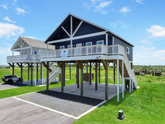 1025 Sunset Cir W, Crystal Beach, TX 77650 - view of playground featuring stairs, a lawn, and a deck
