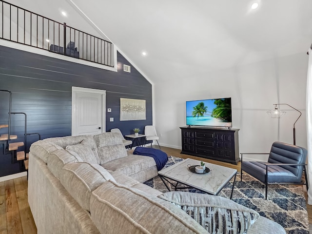 1025 Sunset Cir W, Crystal Beach, TX 77650 - living room featuring wood finished floors, high vaulted ceiling, and recessed lighting