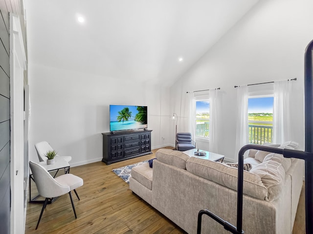 1025 Sunset Cir W, Crystal Beach, TX 77650 - living room featuring hardwood / wood-style floors, high vaulted ceiling, and recessed lighting