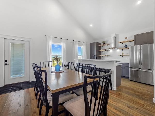 1025 Sunset Cir W, Crystal Beach, TX 77650 - dining space featuring light wood-style floors, recessed lighting, and high vaulted ceiling