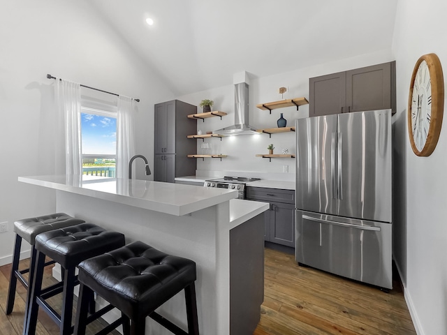 1025 Sunset Cir W, Crystal Beach, TX 77650 - kitchen with appliances with stainless steel finishes, island range hood, open shelves, gray cabinets, and light countertops