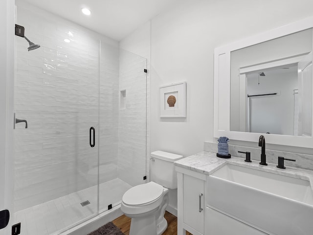 1025 Sunset Cir W, Crystal Beach, TX 77650 - bathroom with vanity, wood finished floors, a shower stall, and recessed lighting