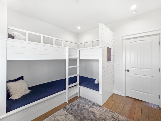 1025 Sunset Cir W, Crystal Beach, TX 77650 - unfurnished bedroom with hardwood / wood-style floors and recessed lighting